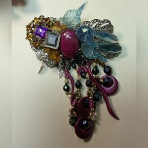 Wendy Gell broochpurple dangles Swarovski jewels and leaves.